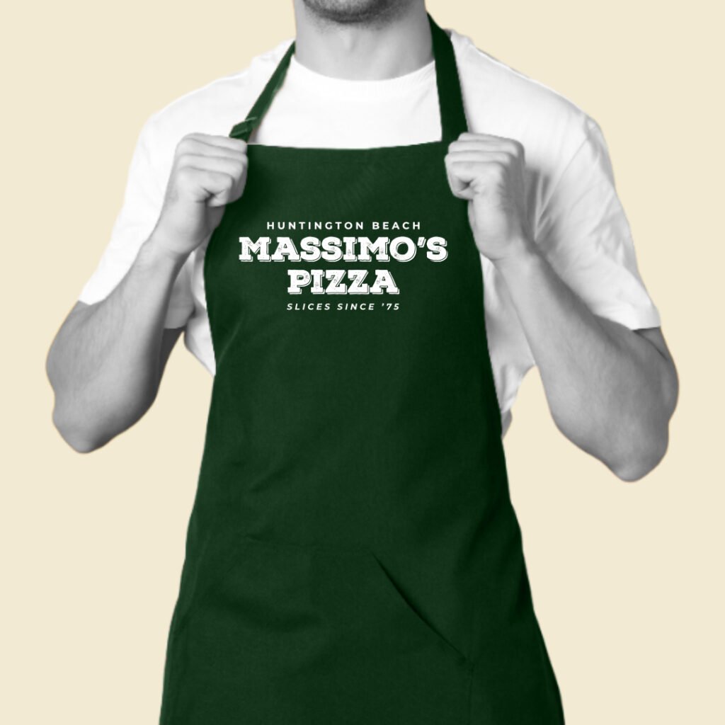 Massimo’s Pizza rebrand logo printed on green staff apron.
